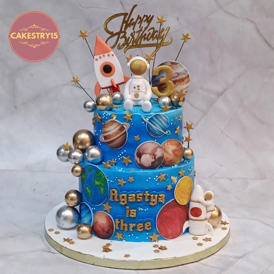 Eggless astronaut space theme cake Noida featuring rockets and edible planets, designed as a kids birthday cake for memorable celebrations.