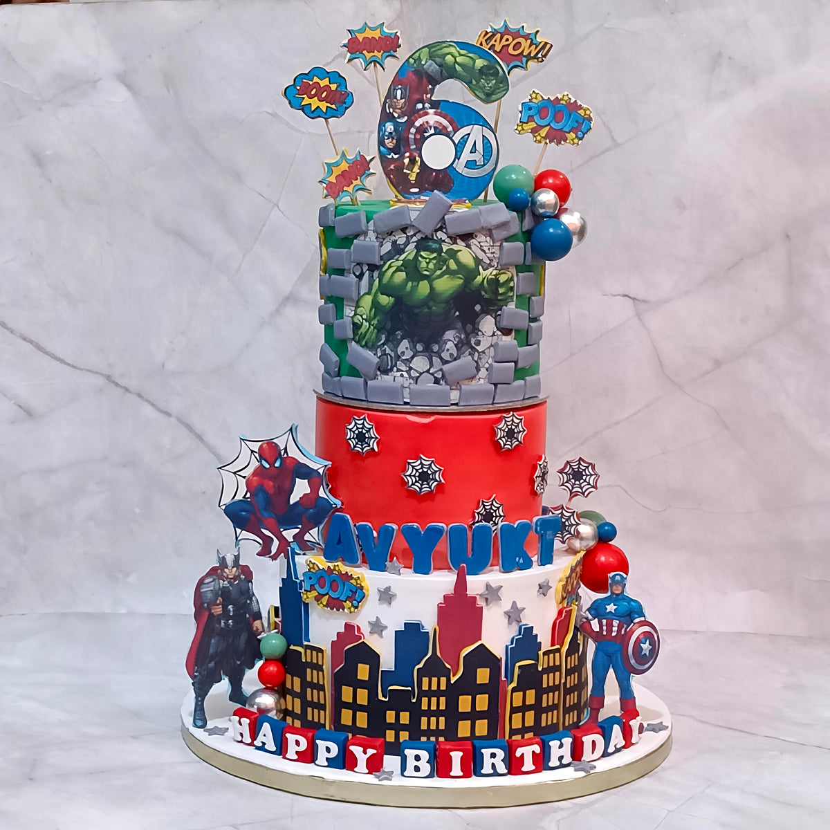Avengers superhero kids birthday cake with Hulk, Thor and Spiderman details from an eggless cakes bakery offering a theme cake Noida.