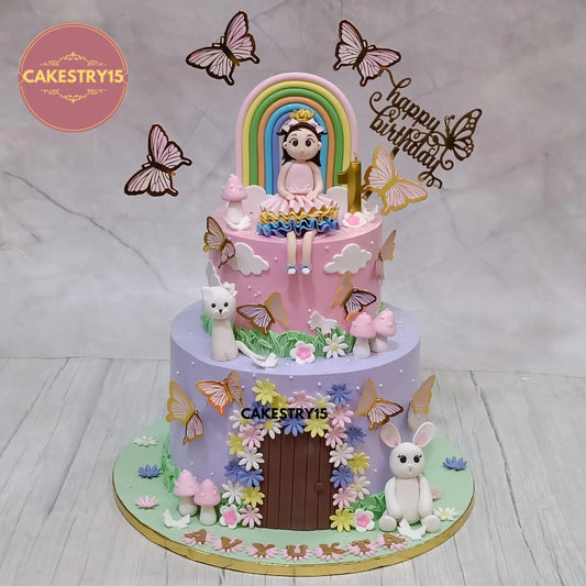4kg eggless choco vanilla first birthday cake with girl figurine rainbow cat rabbit and butterflies from Cakestry15 Noida