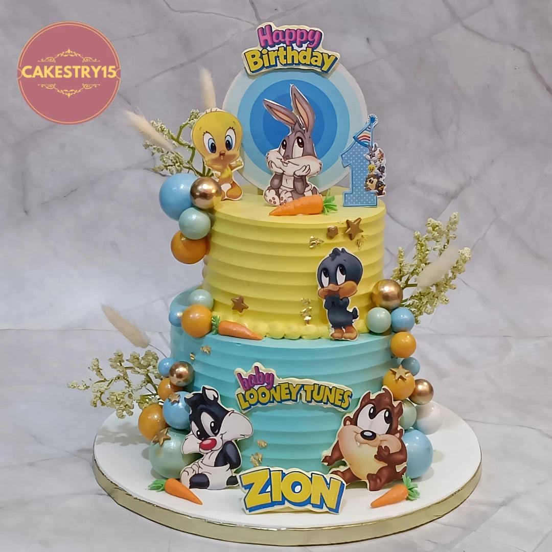 Baby Looney Tunes kids birthday cake featuring Baby Tweety, Bugs Bunny and friends, handcrafted as an eggless theme cake Noida families love for first birthday celebrations.