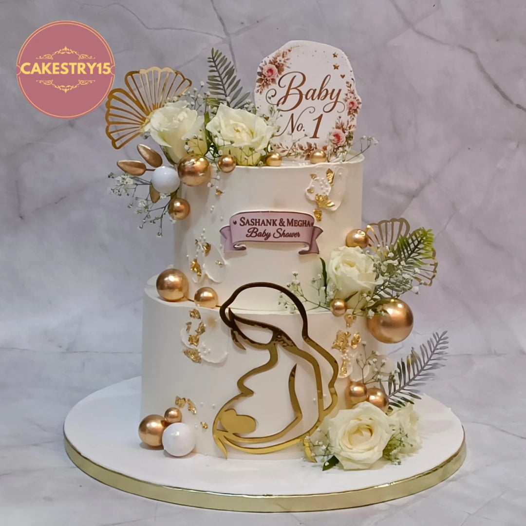 Premium eggless baby shower theme cake with floral decorations, crafted for elegant celebrations and fresh cake delivery in Noida.