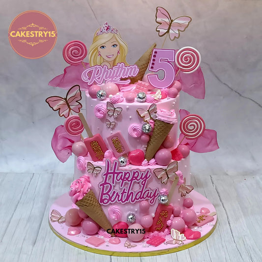 7kg Barbie chocolate birthday cake with ice cream cone toppers, pink faux balls, candy swirls, and butterflies from Cakestry15 Noida
