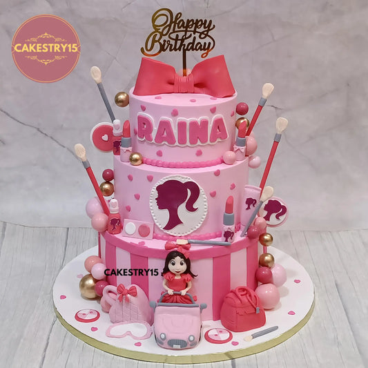 Barbie theme 5kg 3-tier chocolate cake with girl figurine, makeup toppers, and fondant decorations by cakestry15 noida