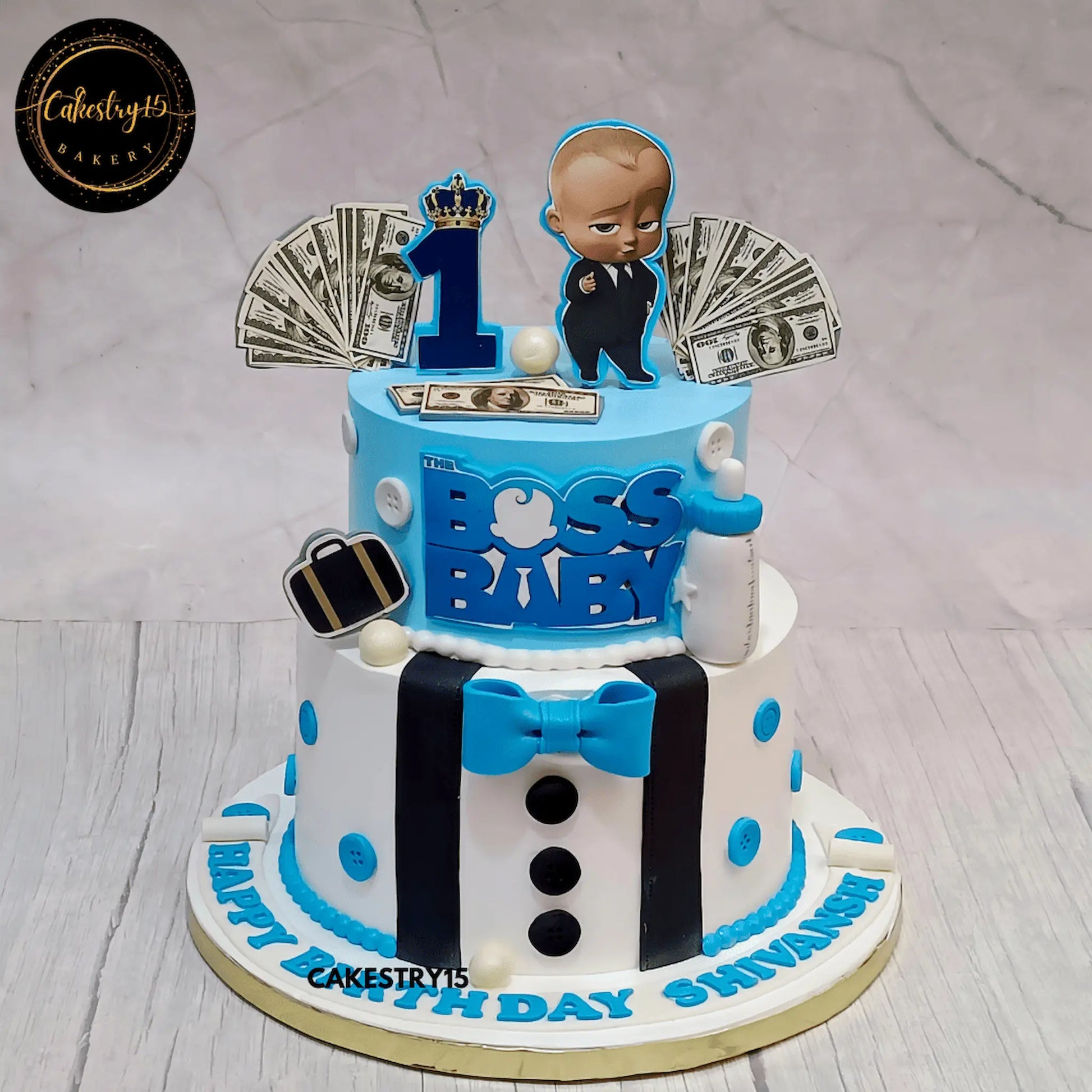 Two-tier Boss Baby theme chocolate cake for Shivansh's first birthday with edible figurines and fondant decor by cakestry15 noida
