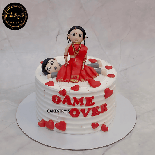 Bride to be Game Over blueberry cake with bride figurine in saree sitting on groom by cakestry15,best bakery noida