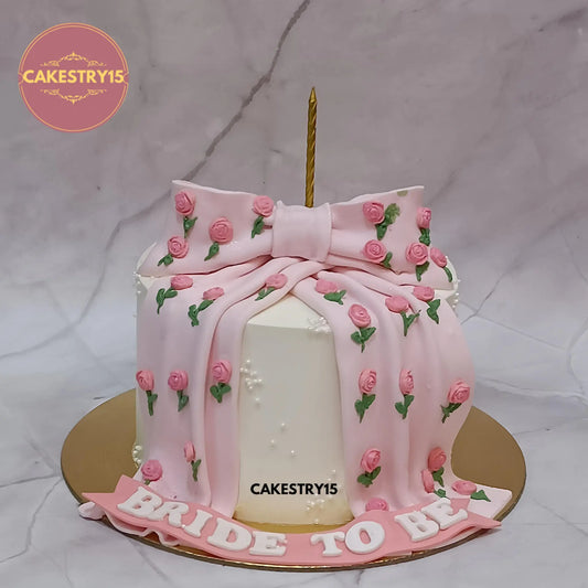 1kg truffle flavour bride to be celebration cake with pink bow and fondant rosettes by Cakestry15 Noida