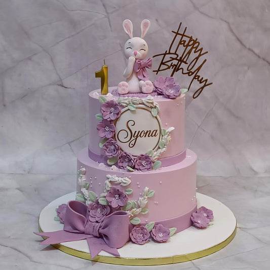 Premium bunny theme kids birthday cake with pink flowers, handcrafted as a theme cake Noida using fresh eggless cakes for a girl's first birthday.