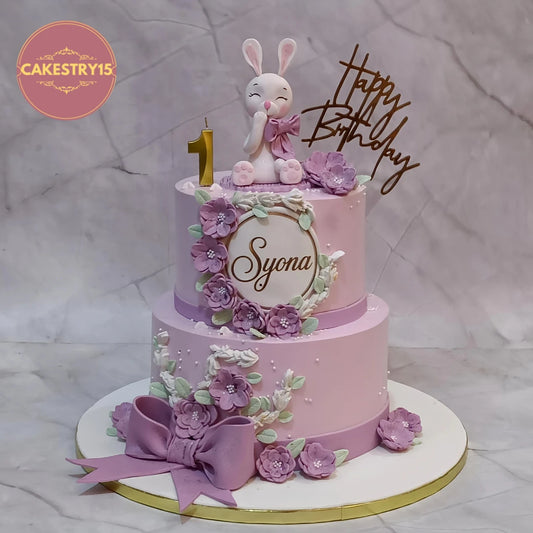 Premium bunny theme kids birthday cake with pink flowers, handcrafted as a theme cake Noida using fresh eggless cakes for a girl's first birthday.