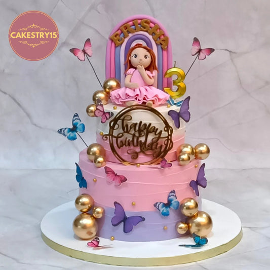 Butterfly theme kids birthday cake with edible butterflies and rainbow details from an eggless cakes bakery offering a theme cake Noida.