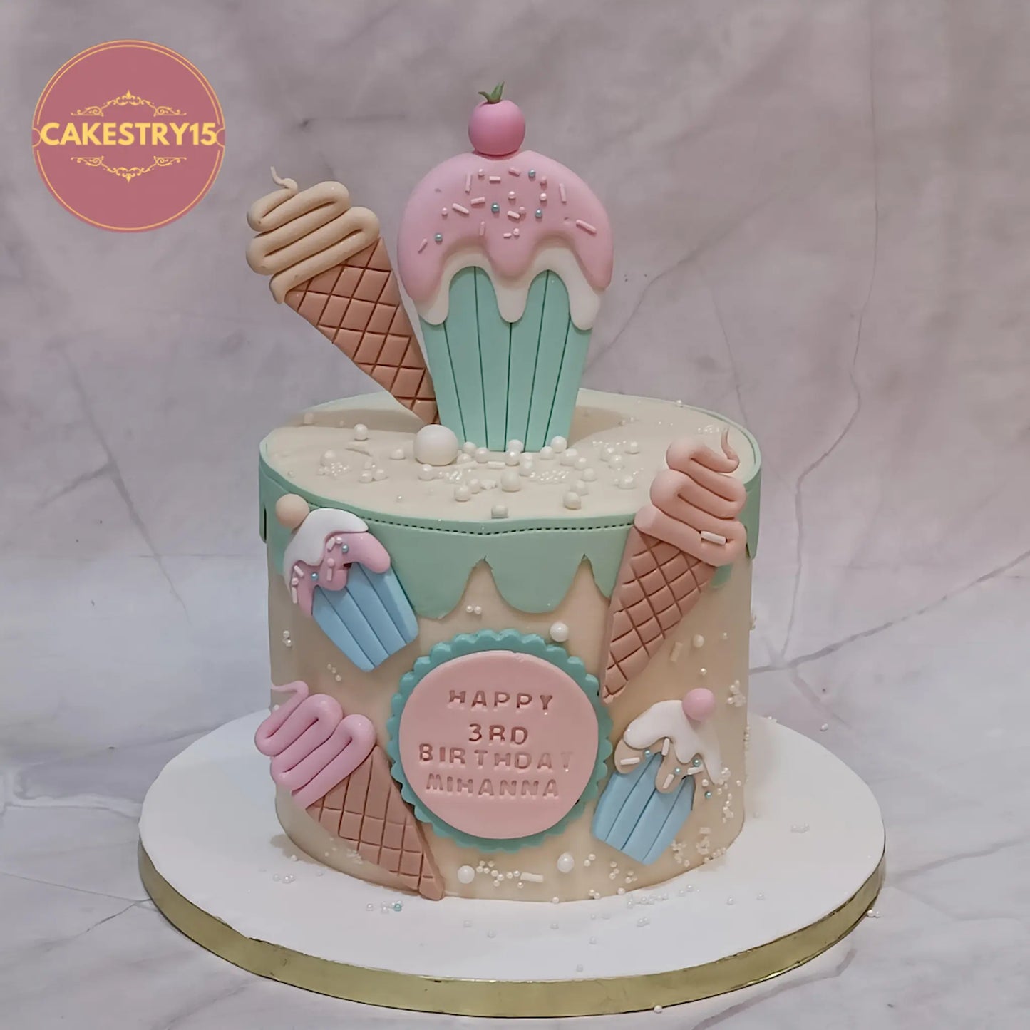 Candy Delight 3rd birthday cake in Noida with candy theme fondant cupcakes, waffle ice creams and pearl detailing, eggless choco vanilla kids cake by Cakestry15