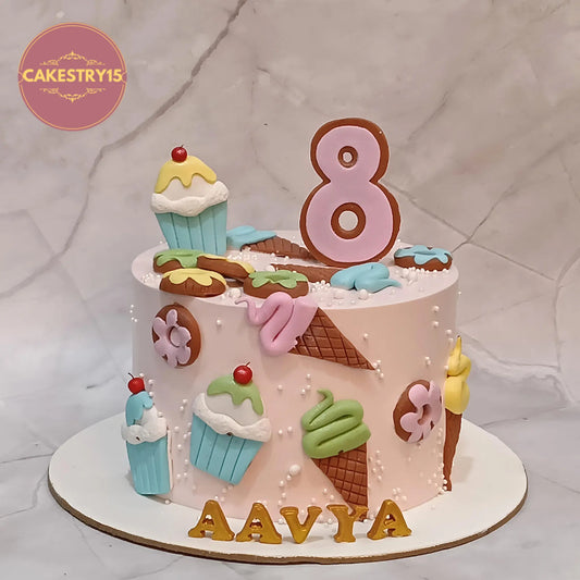 Candyland kids birthday cake with donuts and cupcakes, theme cake Noida from eggless cakes bakery