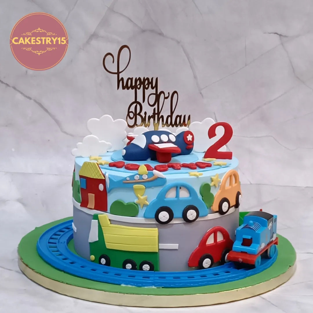 Eggless kids birthday cake with car and train theme cake Noida design for a 2nd birthday celebration