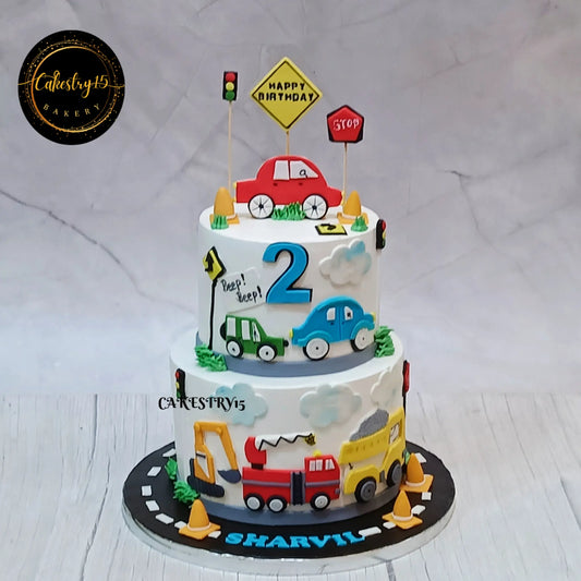 Eggless car theme 3kg kids birthday cake in blueberry flavour with fondant cars, trucks, and road elements by Cakestry15 Noida