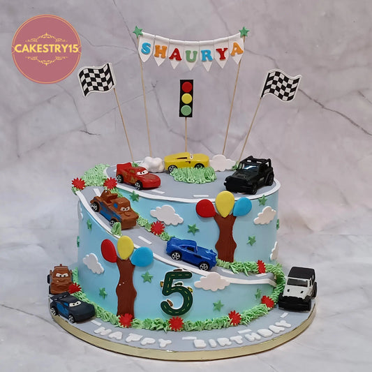 Eggless car theme birthday cake for boys with toy cars and traffic signs, 4kg butterscotch kids birthday cake in Noida by cakestry15