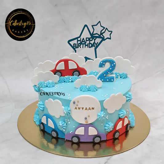 Car theme eggless kids birthday cake in ice blue with 2D cars and fondant clouds, custom cake Noida by Cakestry15