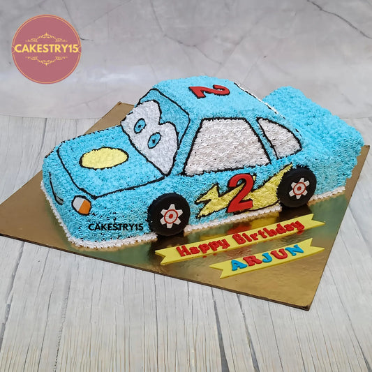 Eggless car theme kids birthday cake in chocolate flavour with colourful cream detailing, custom designed for a 2nd birthday in Noida by Cakestry15.
