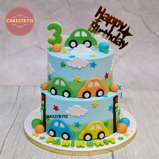 Eggless car theme two tier kids birthday cake with fondant cars and chocolate flavour made in Noida by Cakestry15


