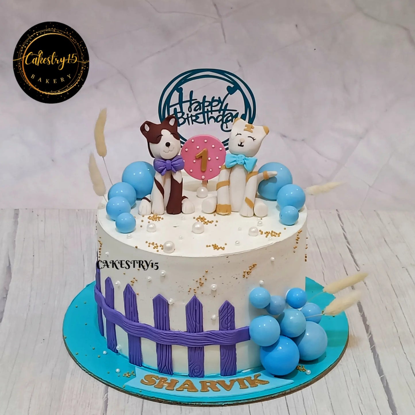 Eggless kids birthday cake with cat and dog theme design for first birthday celebrations, premium theme cake Noida.