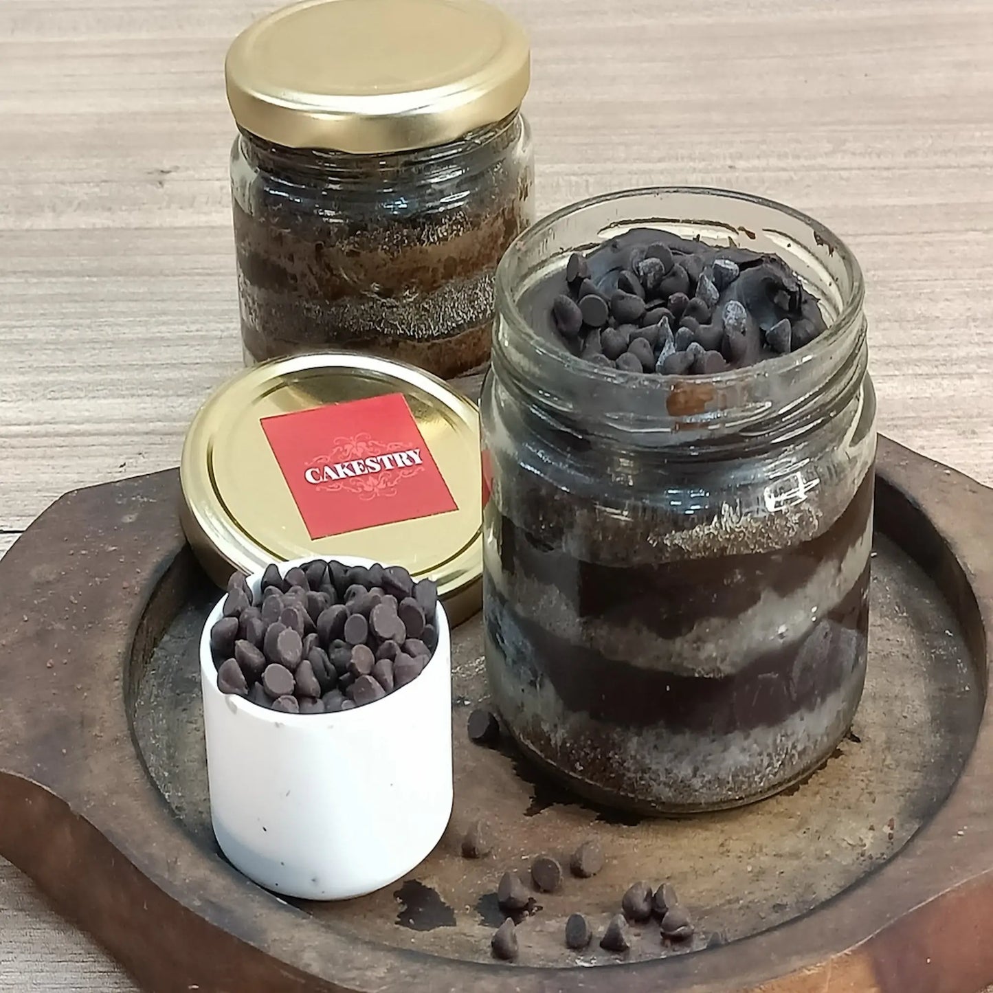 Choco chip cake jar by Cakestry15 with layers of chocolate sponge and choco chips