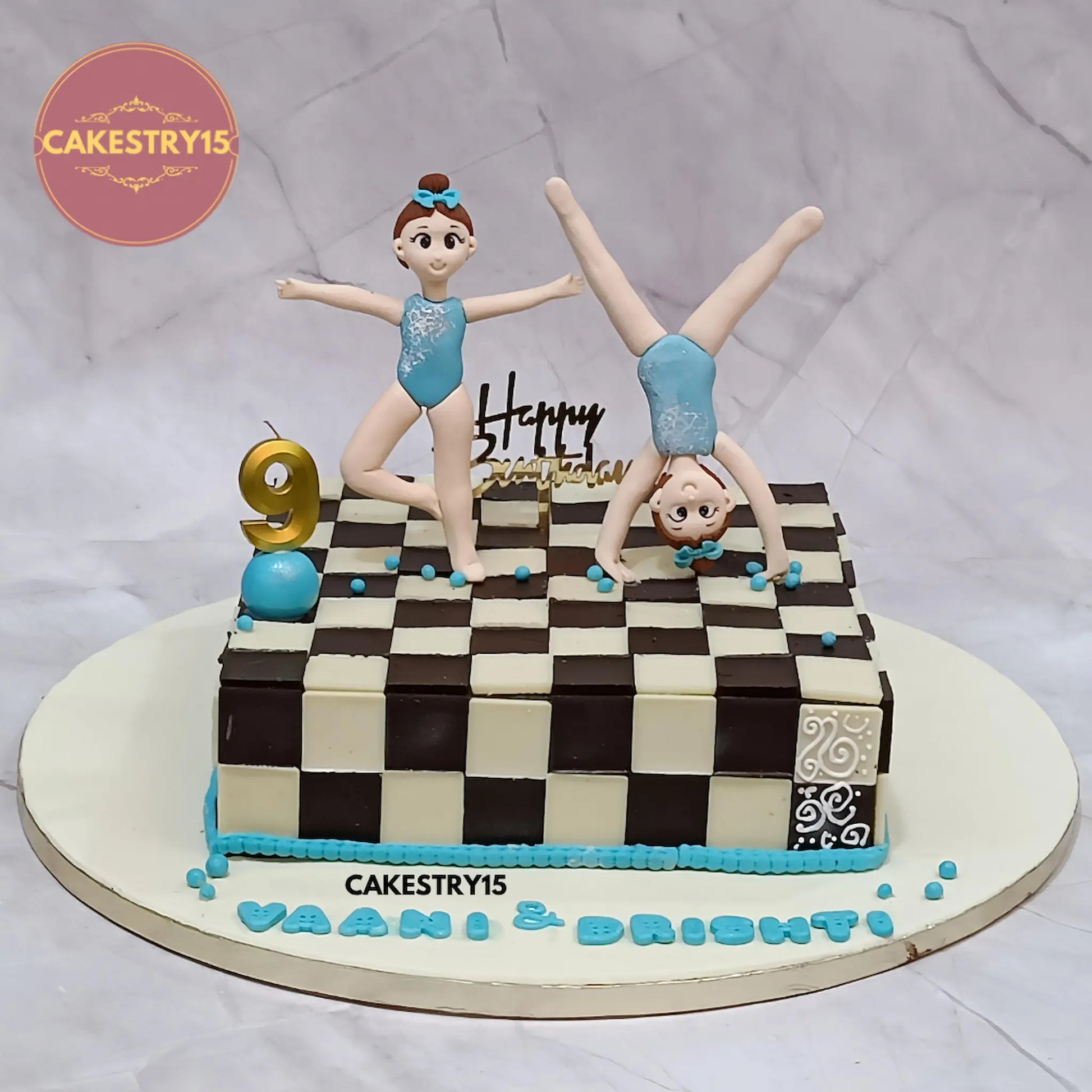 3kg chocolate chess-themed twins birthday cake with girl figurines, age 9 candle, made by Cakestry15 in Noida