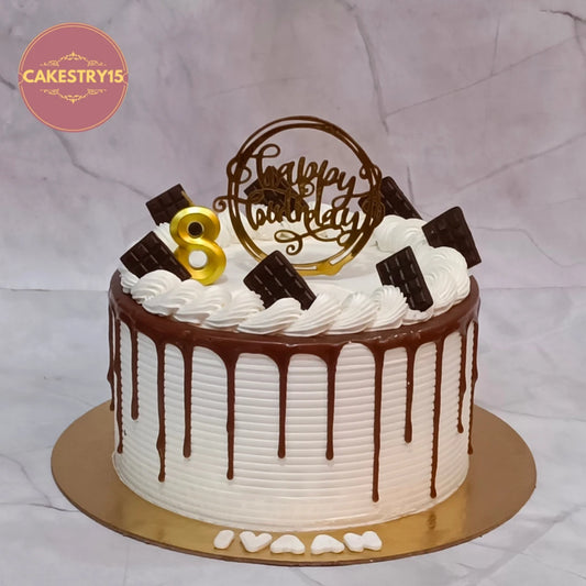 Premium eggless chocolate corporate celebration cake with whipped cream frosting, chocolate drip and mini chocolate bars, ideal for office birthdays, promotions, retirements and anniversaries in Noida.