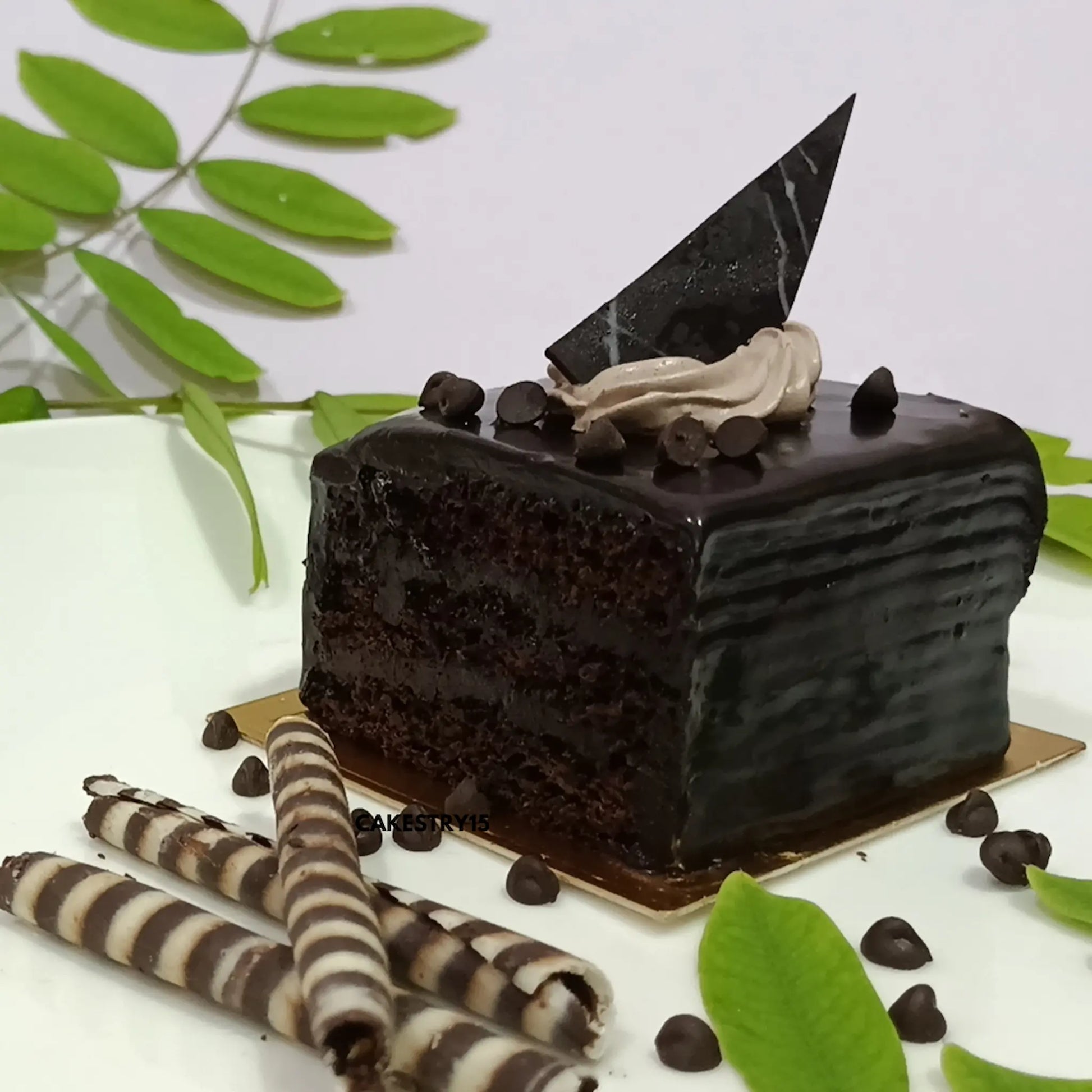 Chocolate truffle pastry by Cakestry15 with dense layers and choco garnishing