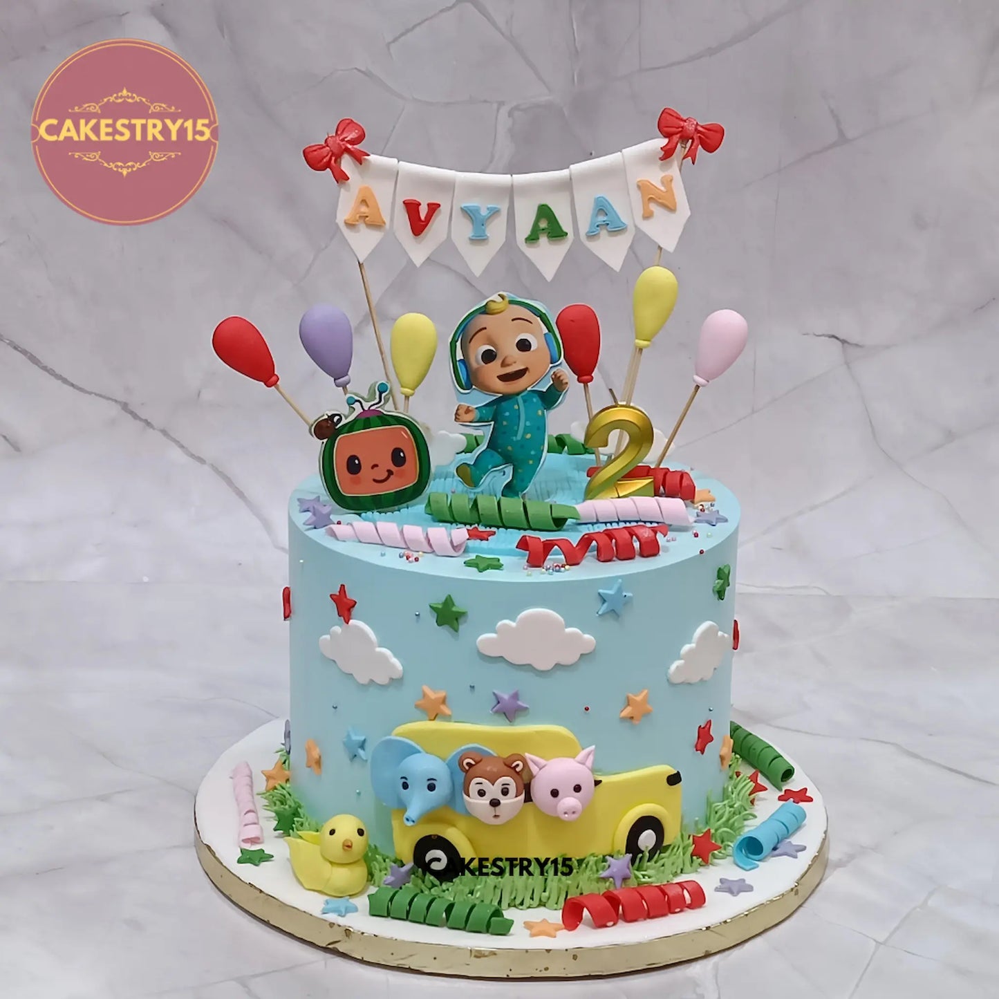 2kg choco vanilla Cocomelon theme birthday cake with fondant bus and characters by Cakestry15 Noida