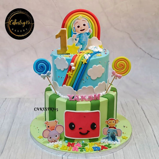 Cocomelon candy swirl first birthday cake with rainbow and clouds, eggless blueberry kids birthday cake in Noida by Cakestry15
