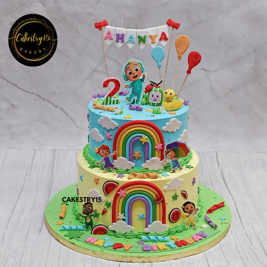 Eggless Cocomelon confetti theme kids birthday cake with fondant characters, balloons and rainbow for 2nd birthday in Noida