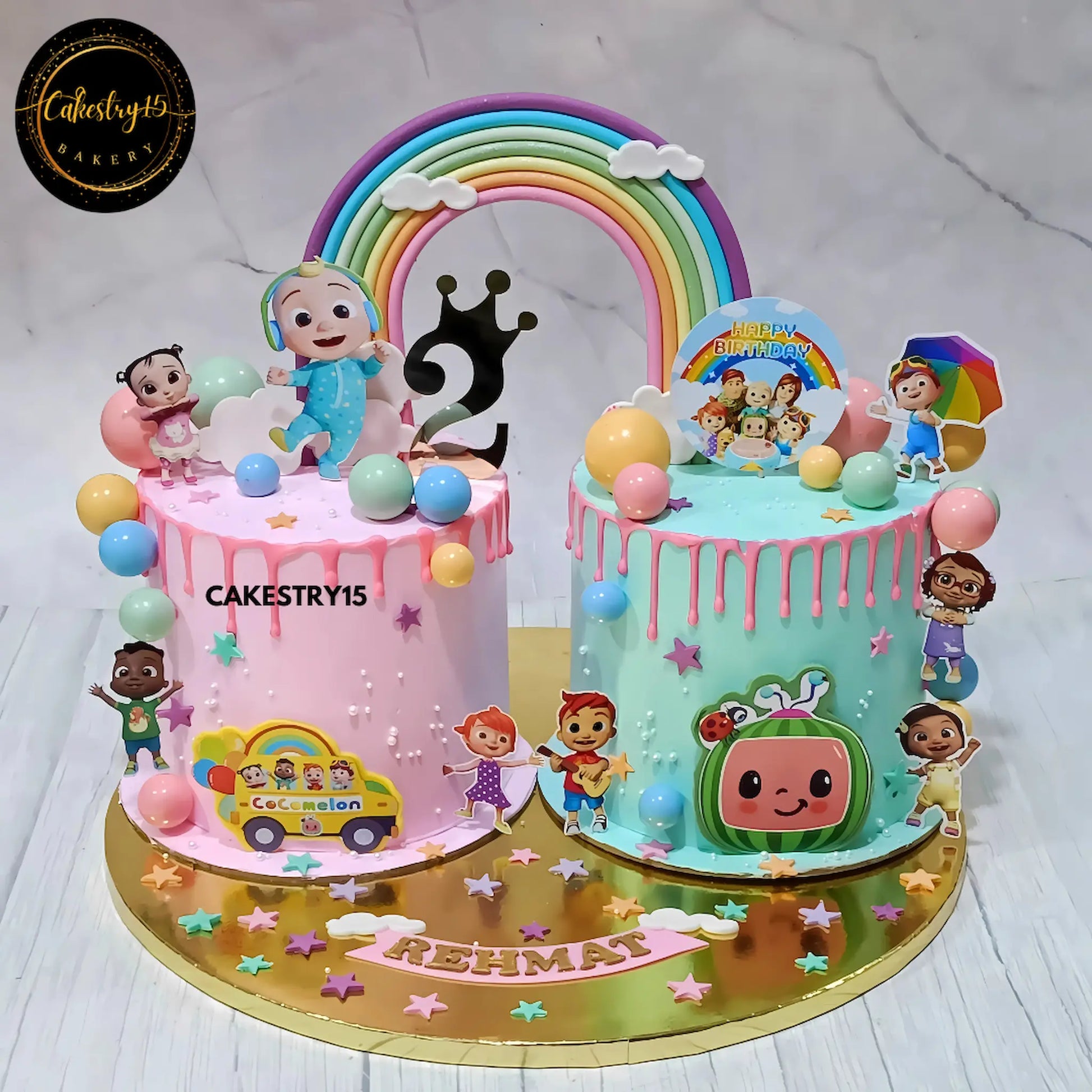 Cocomelon rainbow theme kids birthday cake in mixed fruit flavour eggless custom cake Noida for Rehmat’s 2nd birthday celebration