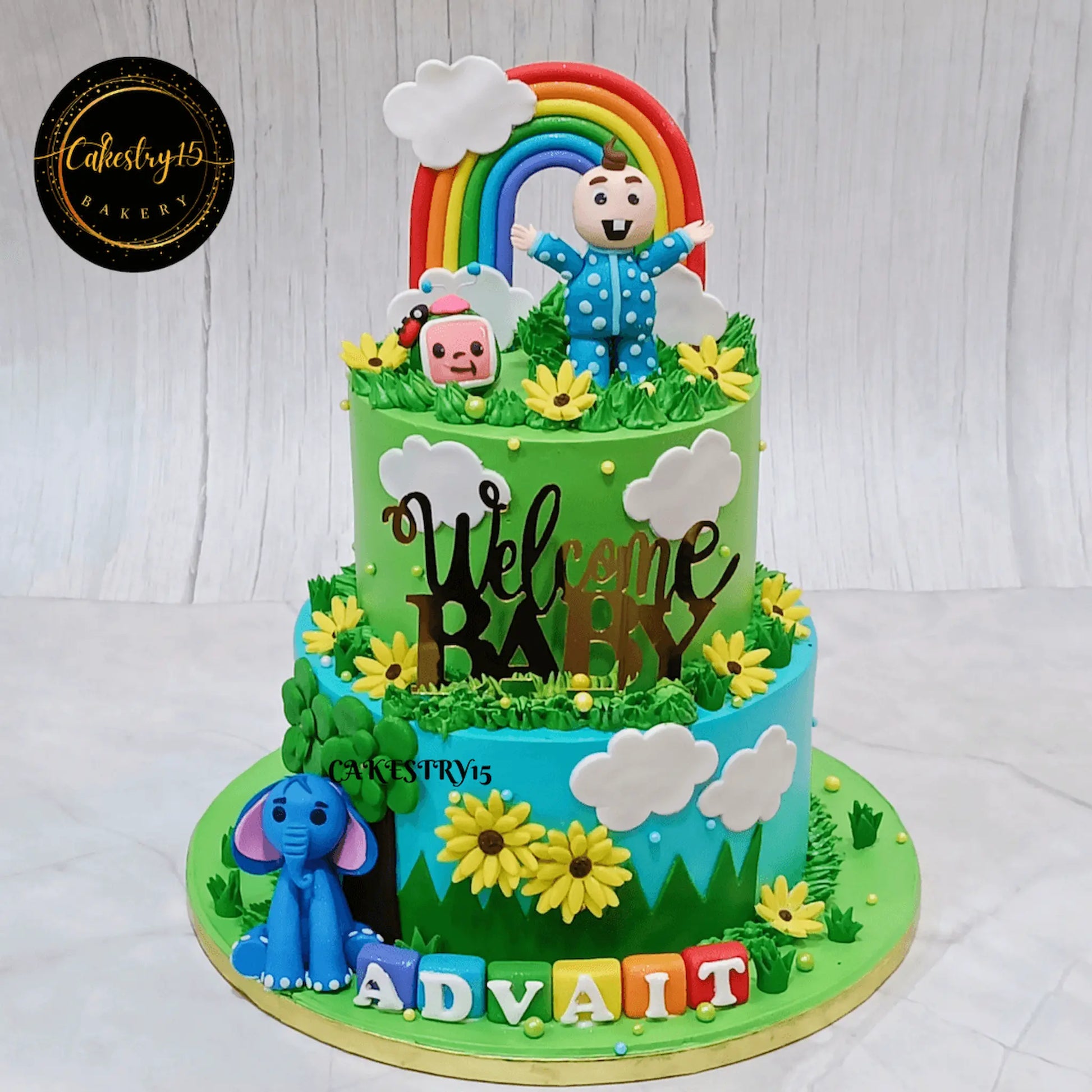 Eggless Cocomelon and elephant welcome baby cake with strawberry flavour, 2 tier custom kids cake by Cakestry15 Noida