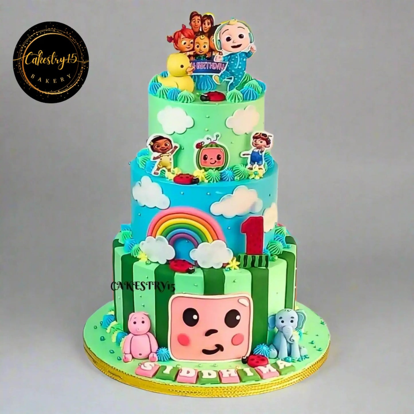 Cocomelon Friends chocolate 3 tier first birthday cake eggless theme cake Noida with duck elephant pig design for kids birthday celebration