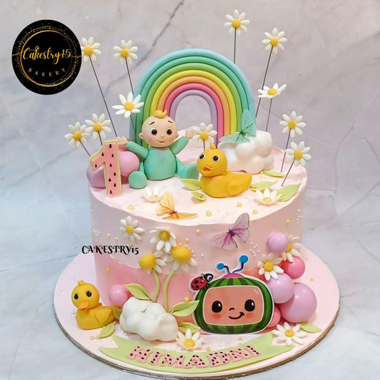 Eggless Cocomelon jamming rainbow duck first birthday cake for kids in Noida with pineapple flavour and fondant decorations
