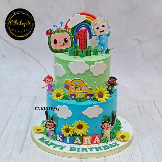 Eggless cocomelon magic theme first birthday cake with rainbow and sunflower design for kids birthday celebration in Noida