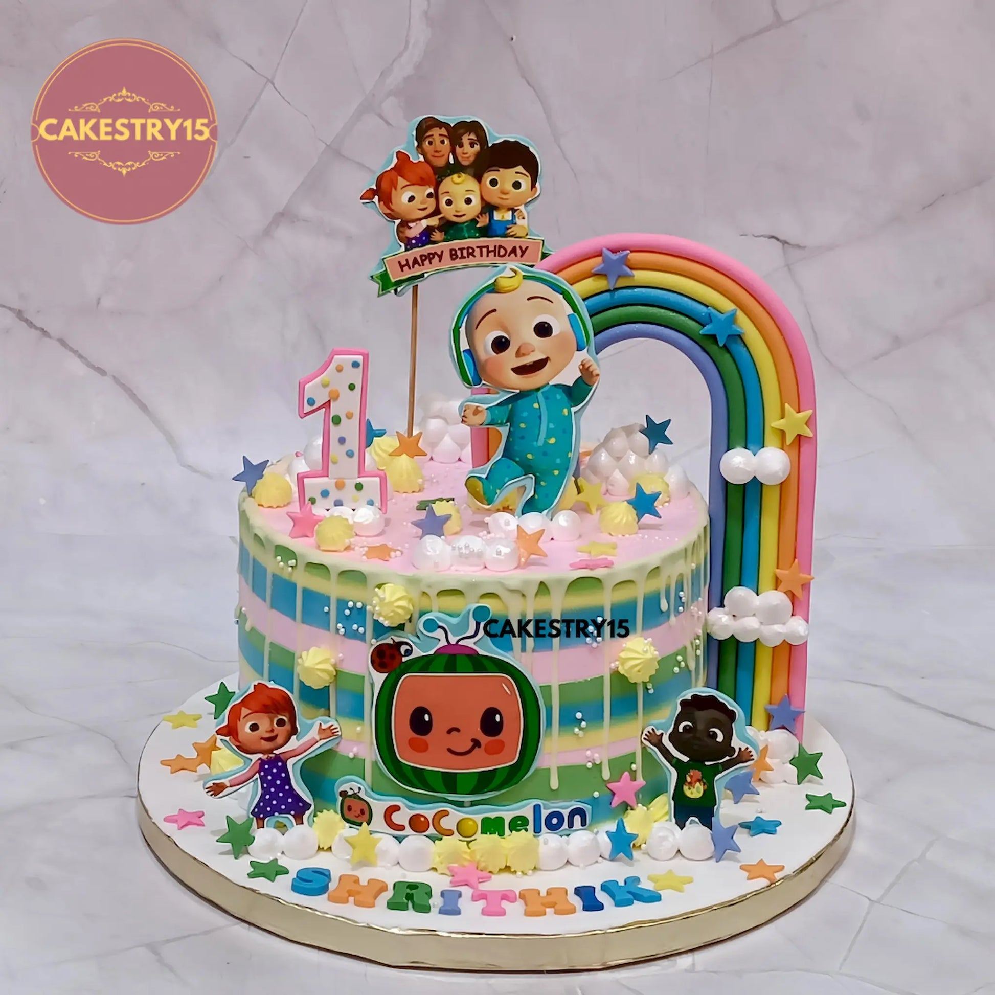 Eggless cocomelon theme first birthday cake with musical garden design for kids birthday celebration in Noida by Cakestry15