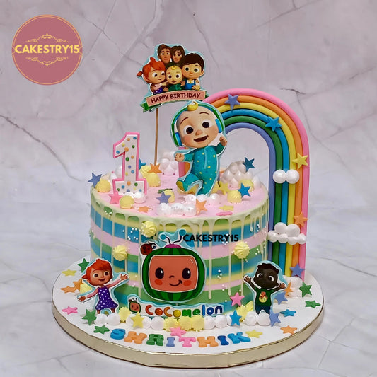 Eggless cocomelon theme first birthday cake with musical garden design for kids birthday celebration in Noida by Cakestry15
