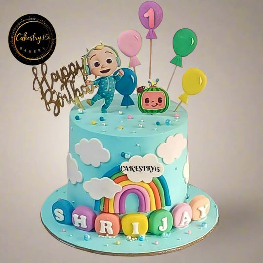 Eggless cocomelon rainbow first birthday cake with pineapple flavour, balloons and toppers for kids birthday cake in Noida