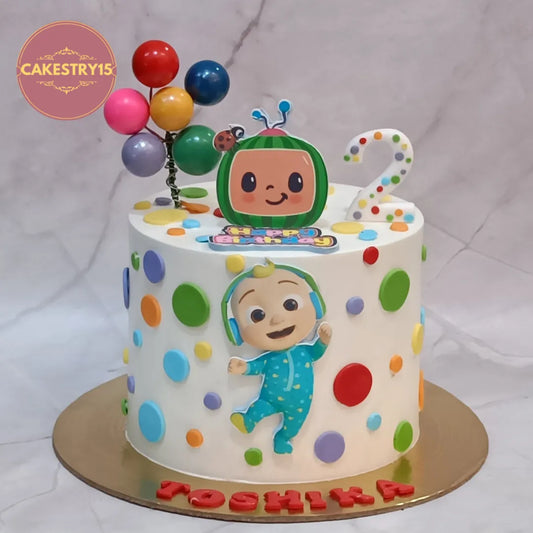 Eggless Cocomelon kids birthday cake with balloons and TV theme design for 2nd birthday celebration in Noida.