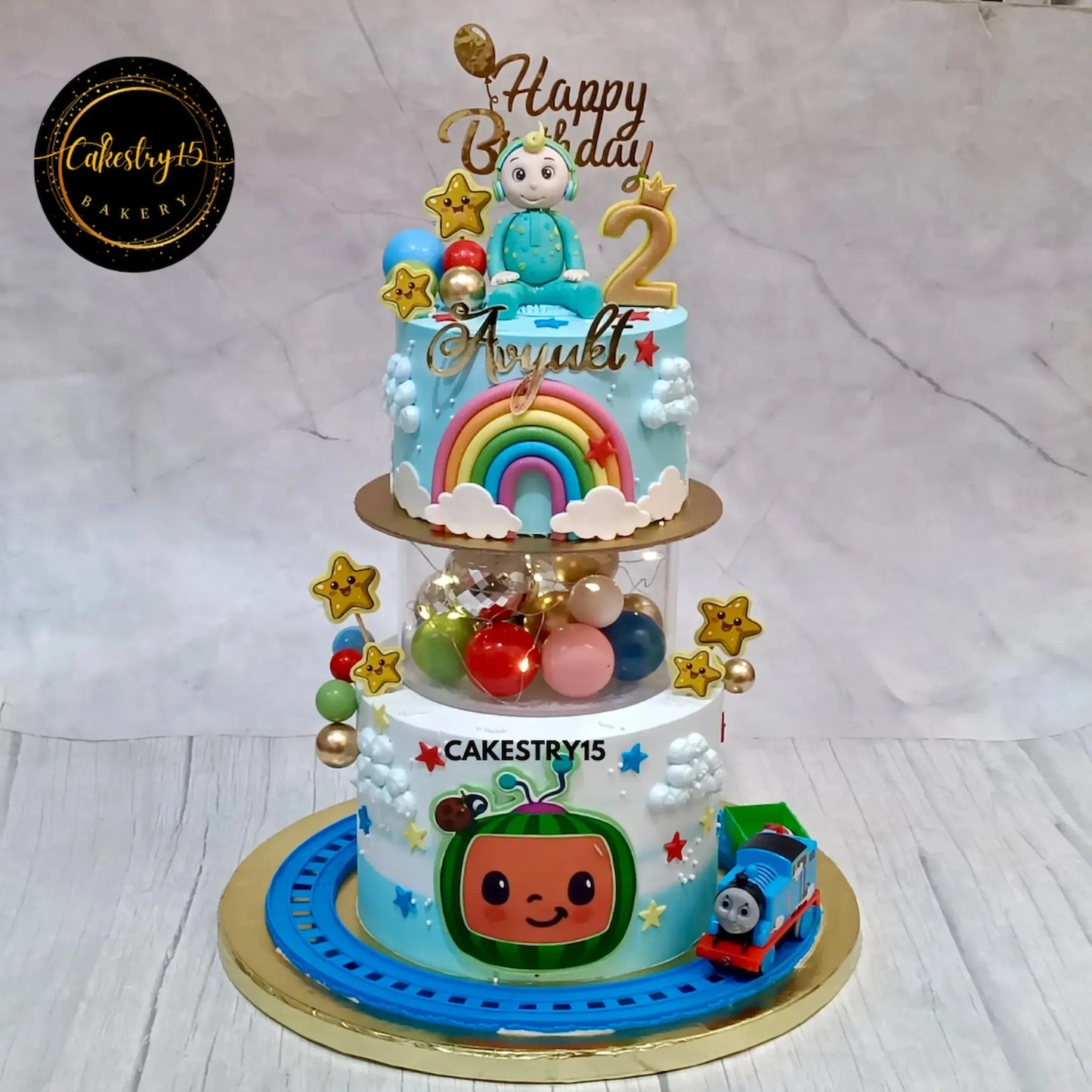 Cocomelon train theme 2nd birthday cake with light spacer eggless choco vanilla kids birthday cake in Noida
