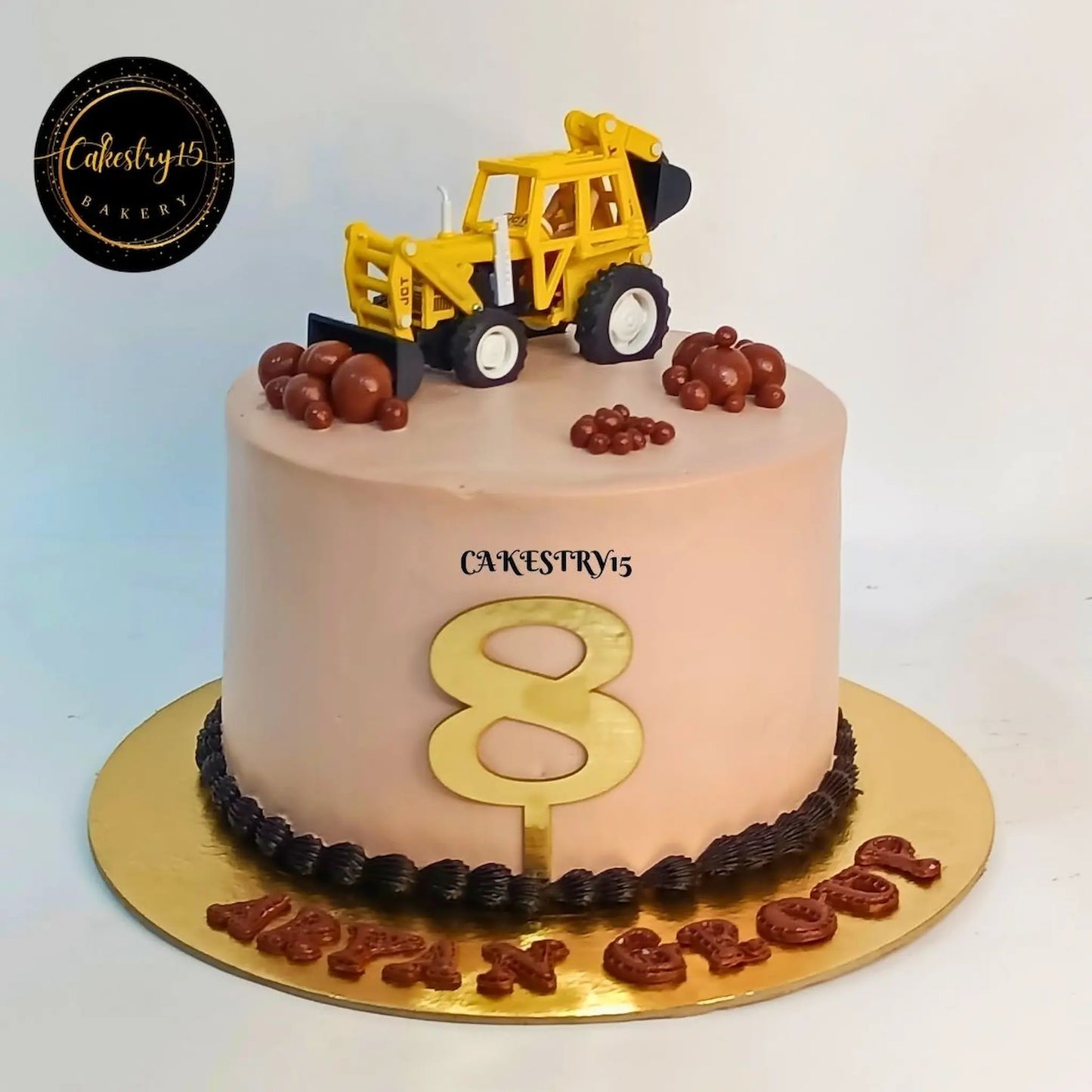 Eggless construction theme cake with JCB toy and fondant rocks, pineapple flavour custom cake for kids birthday and corporate anniversary in Noida by Cakestry15