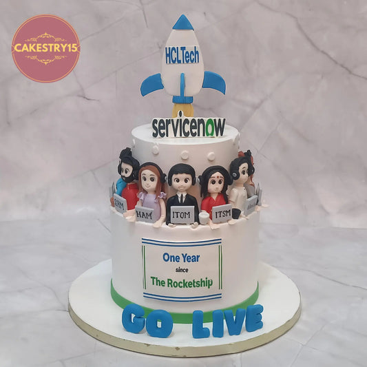 Eggless corporate celebration cake in Noida with rocket topper, office figurines and chocolate flavour by Cakestry15
