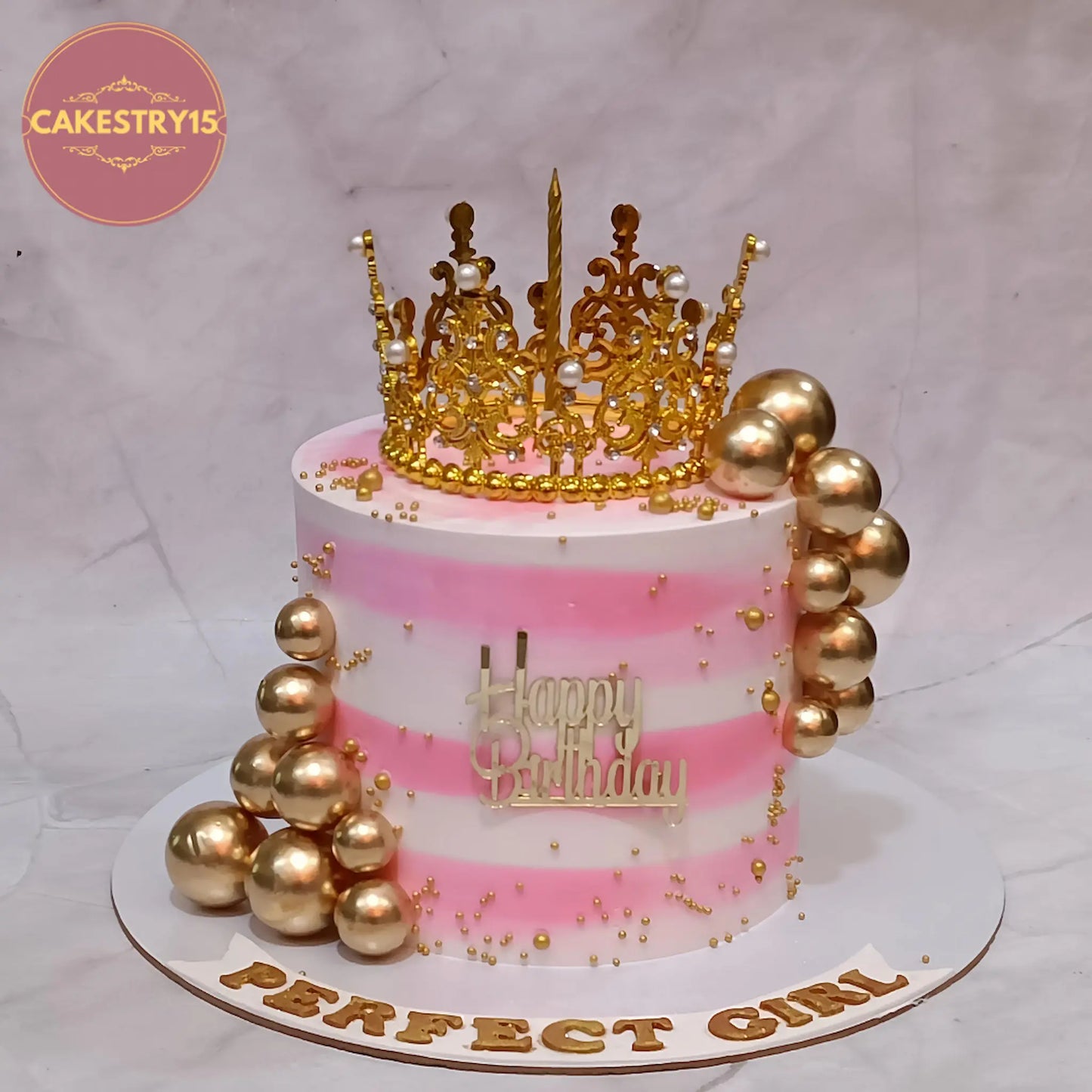 Eggless crown theme girls birthday cake with golden crown, pink and white design, custom kids cake in Noida by Cakestry15