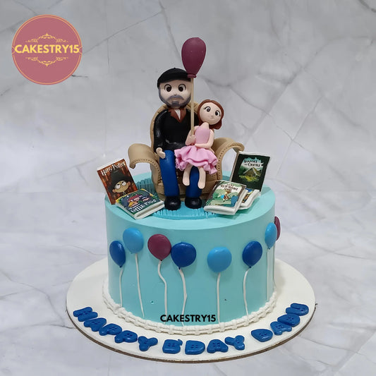 1kg eggless chocolate birthday cake featuring dad figurine with baby and fondant balloons from Cakestry15 Noida