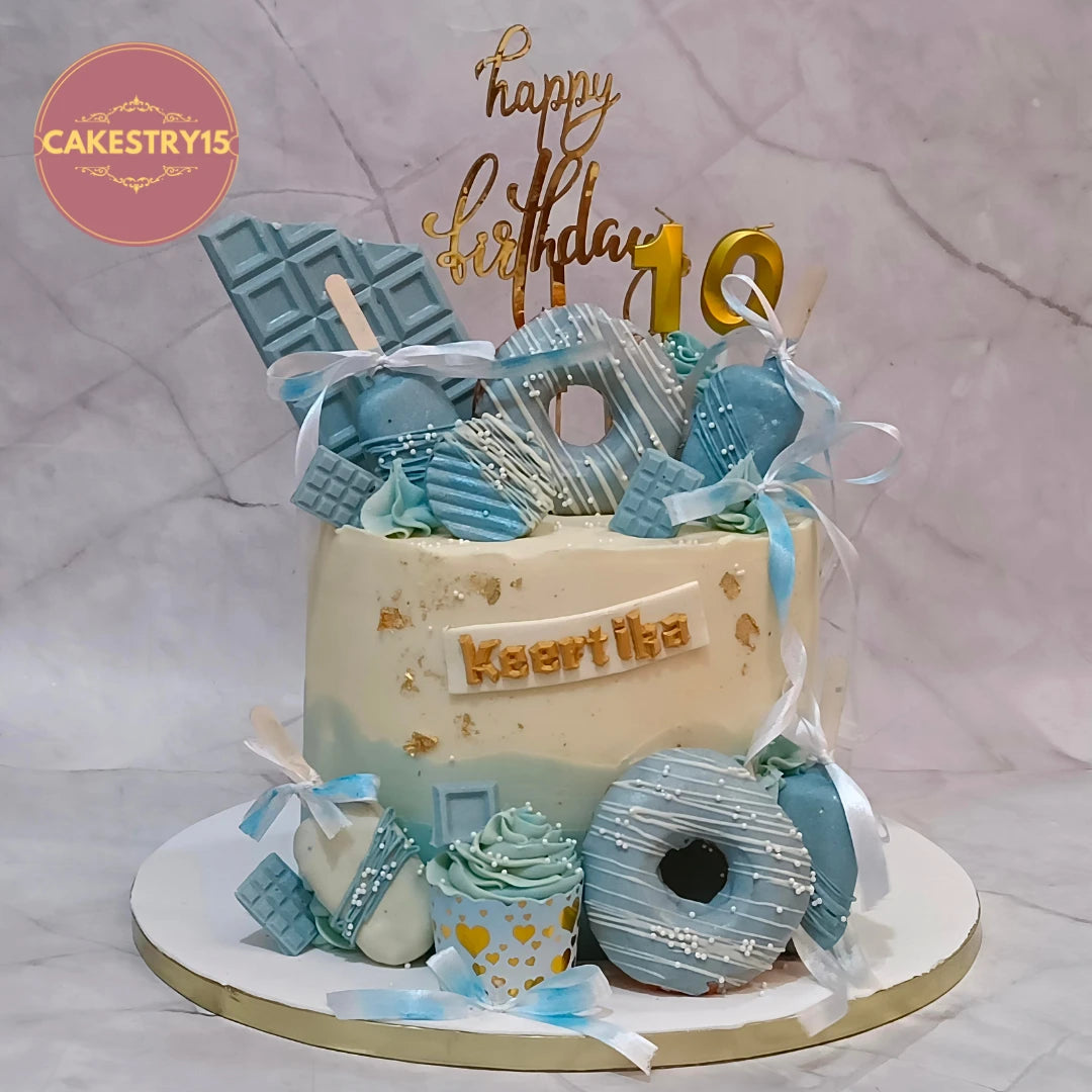 Premium kids birthday cake with real donuts, cupcakes and popsicles, handcrafted as a theme cake Noida using fresh eggless cakes.