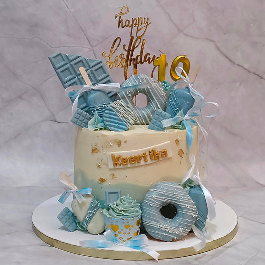 Premium kids birthday cake with real donuts, cupcakes and popsicles, handcrafted as a theme cake Noida using fresh eggless cakes.