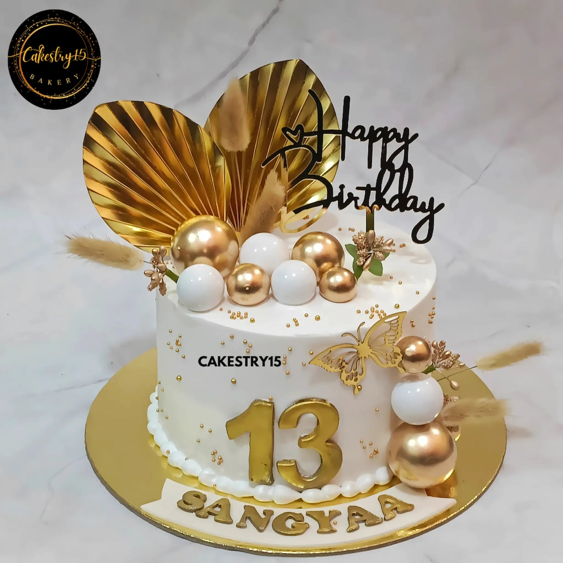 Elegant kids birthday cake with butterflies and golden details, perfect as a theme cake Noida design and premium eggless cakes option.