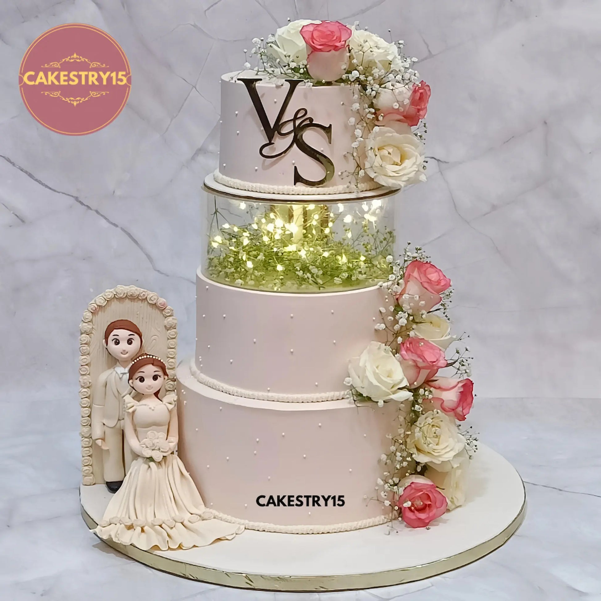 6kg eggless chocolate 4-tier floral engagement cake with custom topper and fondant couple figurines from Cakestry15 Noida