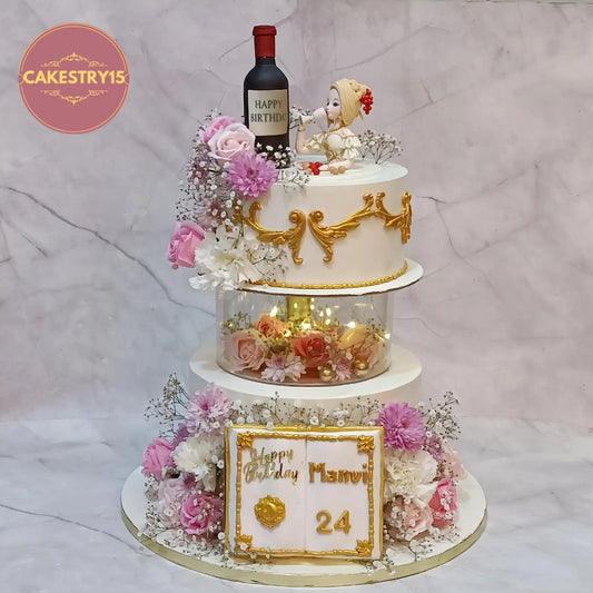 Elegant floral 2 tier chocolate birthday cake with lights spacer and figurine, eggless custom cake for women birthday in Noida by Cakestry15