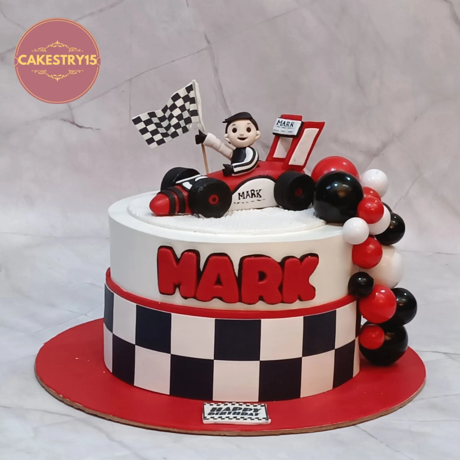 F1 race car theme cake with chequered flag and kid figurine eggless kids birthday cake in Noida
