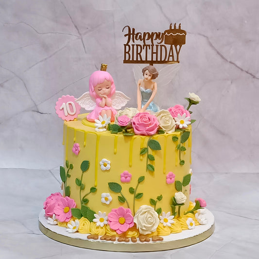 Fairy angel rose floral birthday cake with two fairy toys, fondant roses, flowers, leaves and a birthday topper.